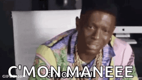 Man In Hat And Colorful Shirt Sitting At Computer Making Funny Face GIF