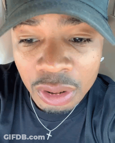 Man In Hat And Cross Necklace GIF