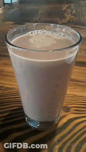 Man In Hat And Glasses Drinking From Orange Cup GIF