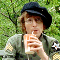 Man In Hat And Glasses Drinking From Orange Cup GIF