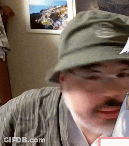 Man In Hat And Glasses Looking At Paper GIF