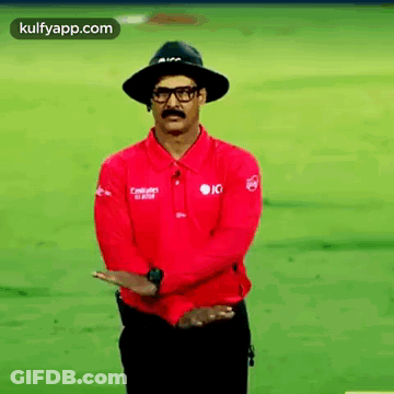 Man In Hat And Glasses Standing With Arms Crossed GIF