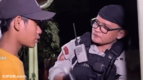 Man In Hat And Glasses Talking To Police Officer GIF