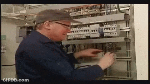 Man In Hat And Glasses Working On Electrical Panel GIF