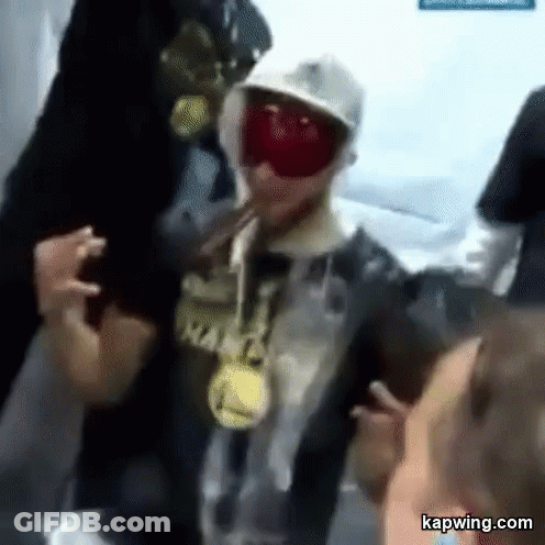 Man In Hat And Goggles With Others GIF