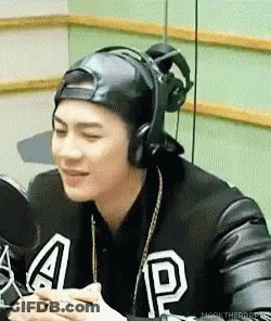 Man In Hat And Headphones At Microphone GIF