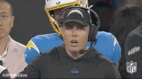 Man In Hat And Headphones Talking To Football Player GIF