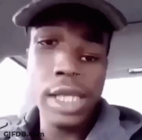 Man In Hat And Hoodie Making Funny Face In Car GIF