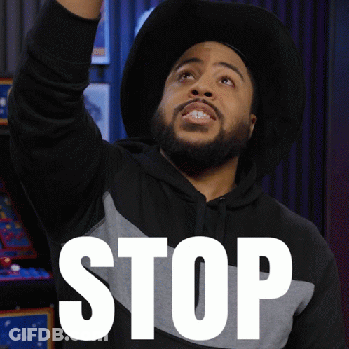 Man In Hat And Hoodie Saying Stop GIF