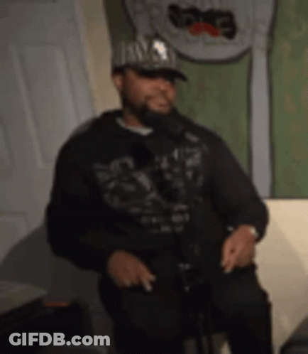 Man In Hat And Hoodie Singing GIF