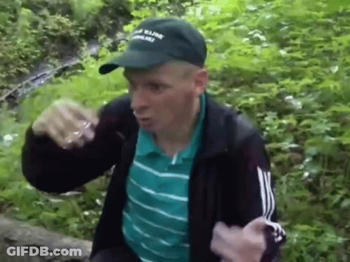 Man In Hat And Jacket In Forest GIF