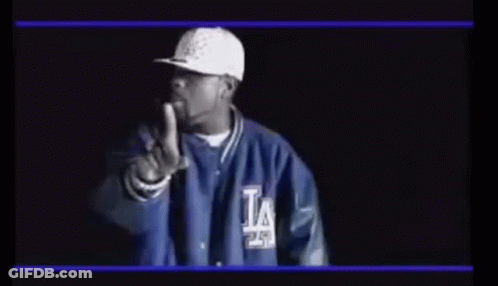 Man In Hat And Jacket Pointing At Camera GIF
