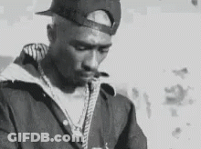 Man In Hat And Jacket Smoking Cigarette Black And White GIF
