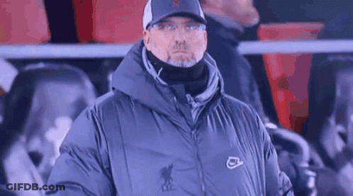 Man In Hat And Jacket Standing In Stands GIF