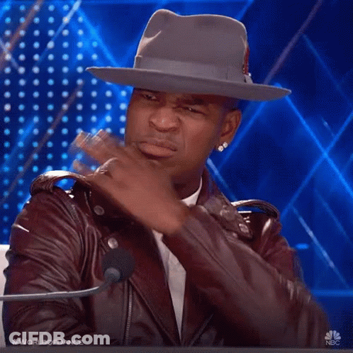 Man In Hat And Leather Jacket At Microphone GIF