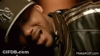 Man In Hat And Leather Jacket Lying Down Mouth Open GIF