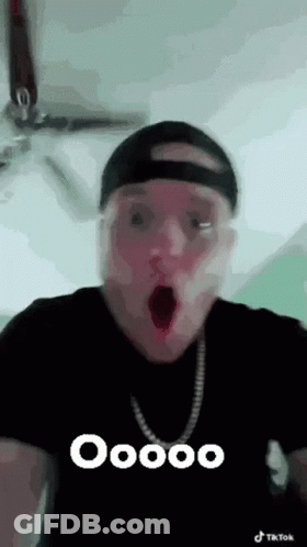 Man In Hat And Necklace Making Funny Face GIF