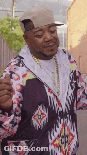 Man In Hat And Patterned Jacket Giving Thumbs Up GIF