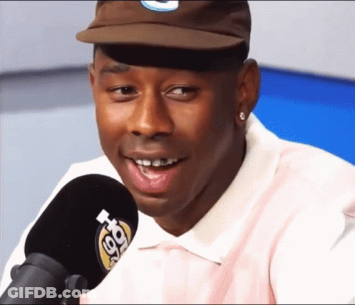 Man In Hat And Pink Shirt Talking Into Microphone 98.7 FM GIF
