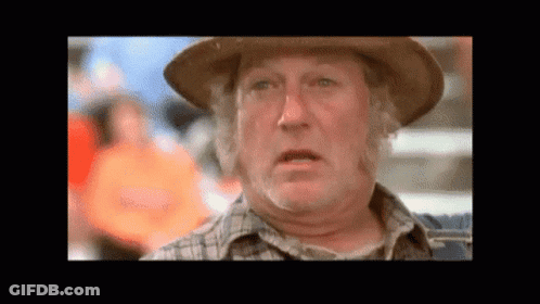 Man In Hat And Plaid Shirt Making Funny Face GIF