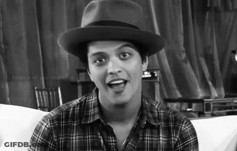 Man In Hat And Plaid Shirt Sitting On Couch GIF
