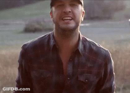 Man In Hat And Plaid Shirt Smiling In Field GIF