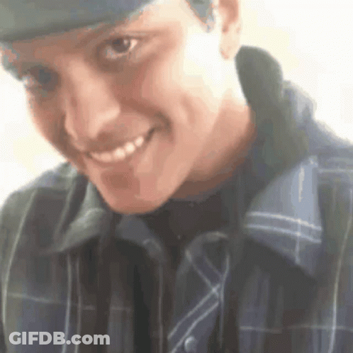 Man In Hat And Plaid Shirt Smiling GIF