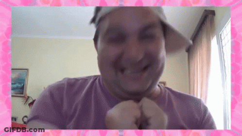 Man In Hat And Purple Shirt Smiling With Pink Frame GIF