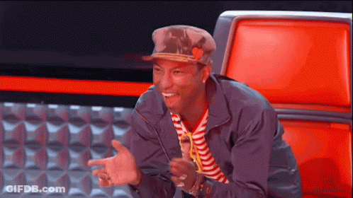 Man In Hat And Striped Shirt Sitting In Red Chair GIF