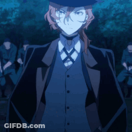 Man In Hat And Suit Standing In Front Of Group GIF