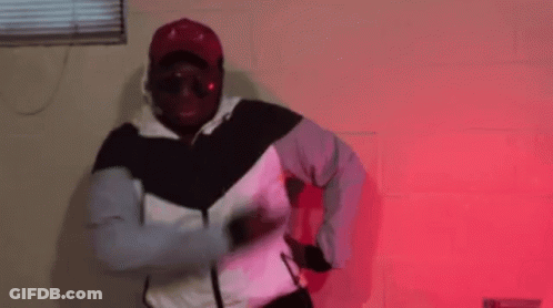 Man In Hat And Sunglasses Dancing In Red Room GIF