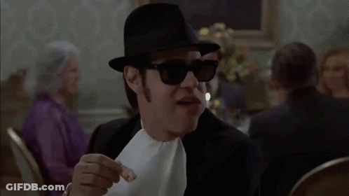 Man In Hat And Sunglasses Eating Bread GIF