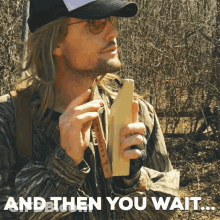Man In Hat And Sunglasses Holding Wooden Object Saying And Then You Wait GIF