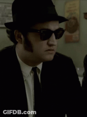 Man In Hat And Sunglasses Looking GIF