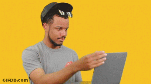 Man In Hat And Sunglasses Looking At Laptop GIF