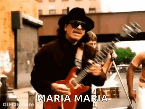 Man In Hat And Sunglasses Playing Guitar On Street GIF