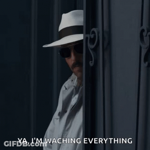 Man In Hat And Sunglasses Says Watching Everything GIF