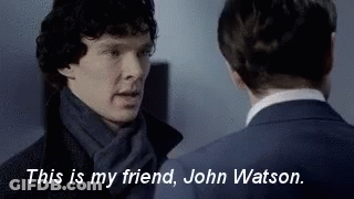 Man In Hat And Sunglasses Smiling At Another Man GIF