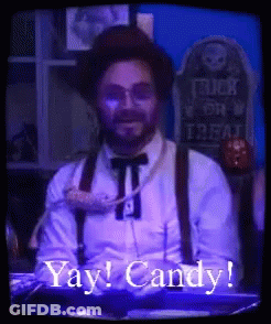 Man In Hat And Suspenders Says Yay Candy GIF