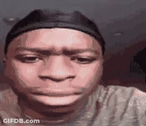 Man In Hat And T-Shirt Making Funny Face GIF