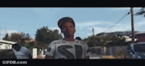 Man In Hat And T-Shirt With Letter S Before Crowd GIF