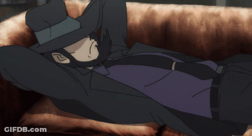Man In Hat And Tie Lying On Couch GIF