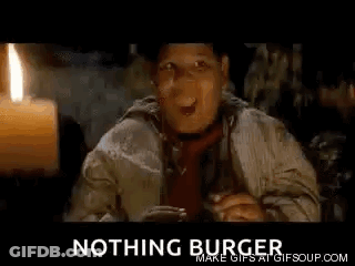 Man In Hat And Tie Sitting By Candle And Nothing Burger Sign GIF