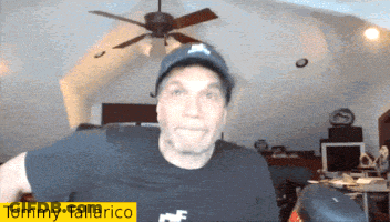 Man In Hat And Tommy Tallarico Shirt GIF