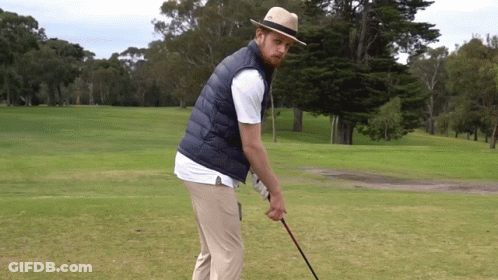 Man In Hat And Vest Holding Golf Club GIF