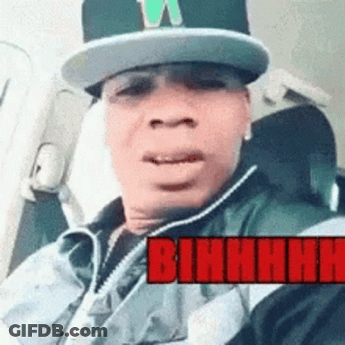 Man In Hat And Vest In Car With Red Bihhhh GIF
