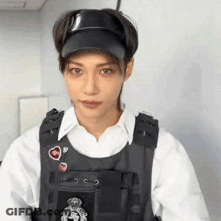 Man In Hat And Vest Standing GIF