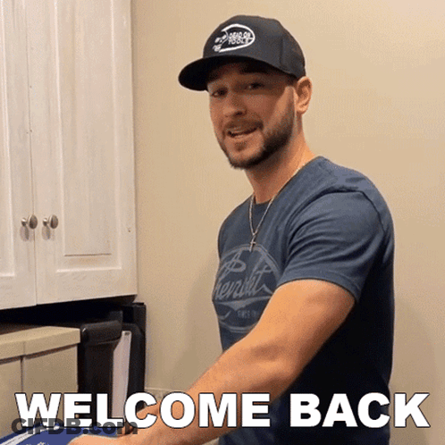 Man In Hat And Welcome Back Shirt GIF