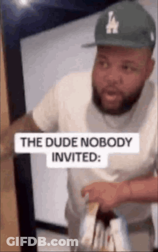 Man In Hat And White Shirt Holding Wine GIF
