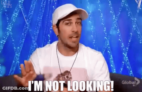 Man In Hat And White Shirt Says I'm Not Looking GIF